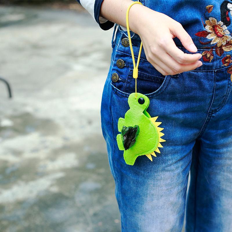 Pet Life ®Fleece Dinosaur Shaped Travel Waste Bag Dispenser with 2 Rolls